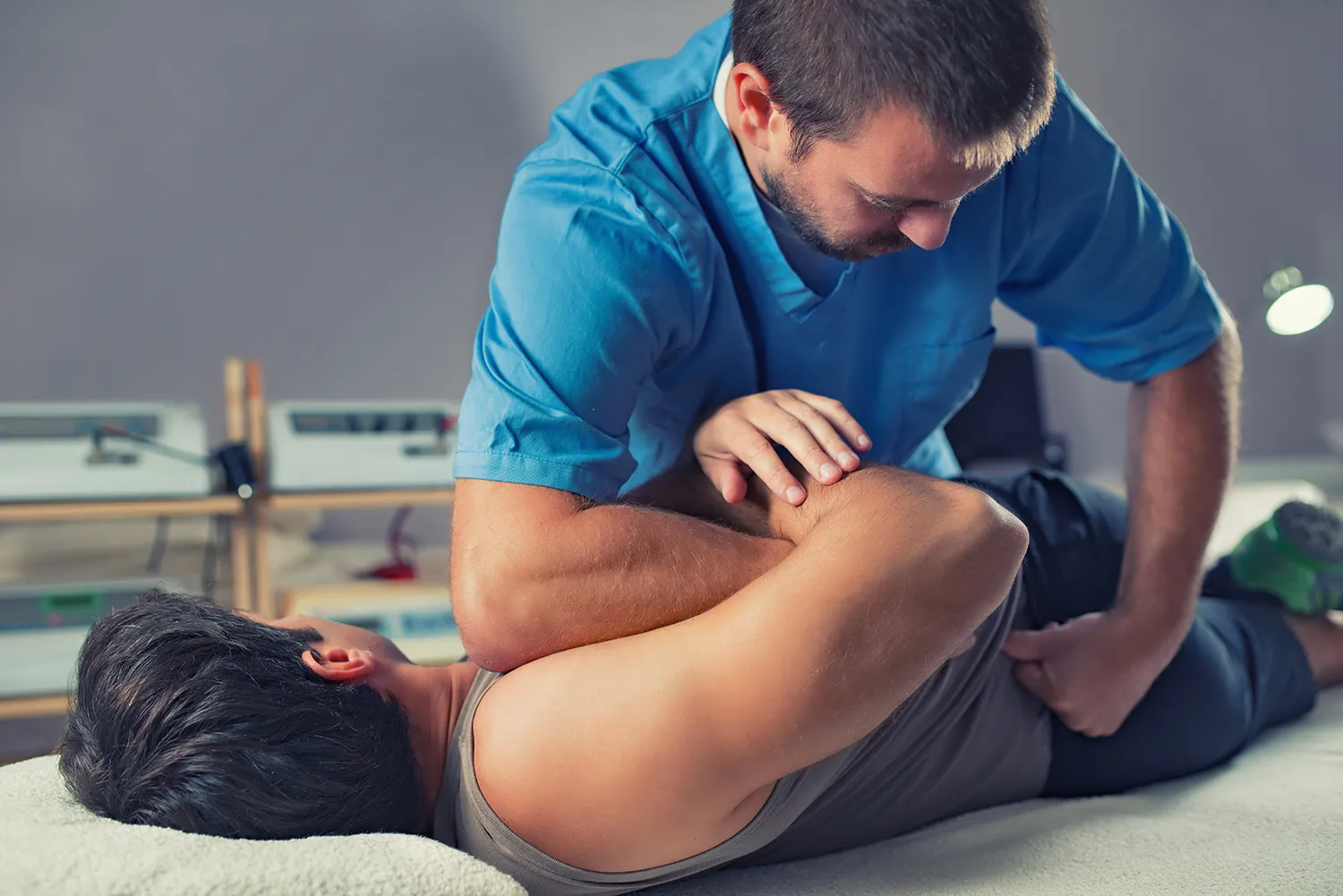 Chiropractor adjusting a patient's back