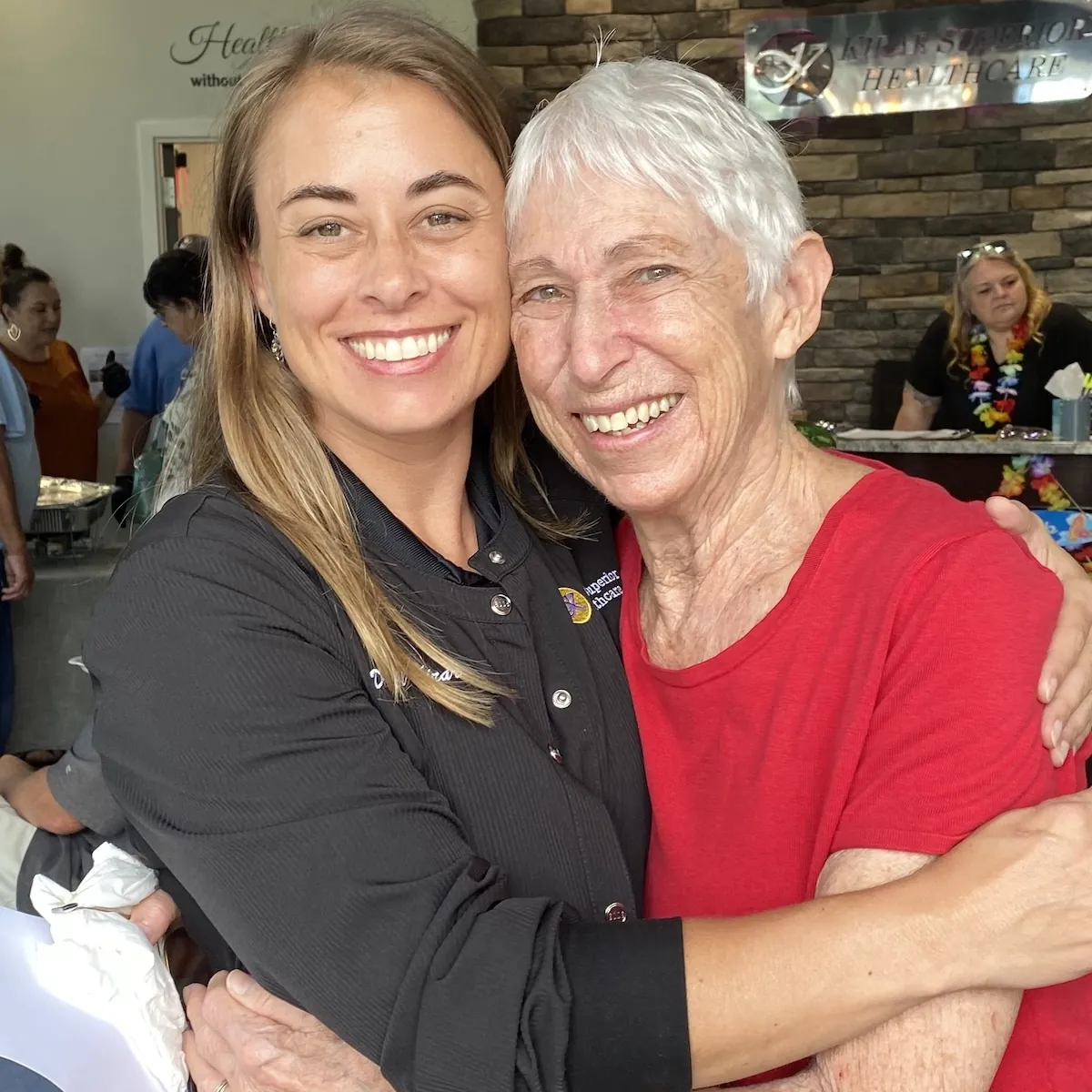 Dr. Jill Kirar hugging a happy patient