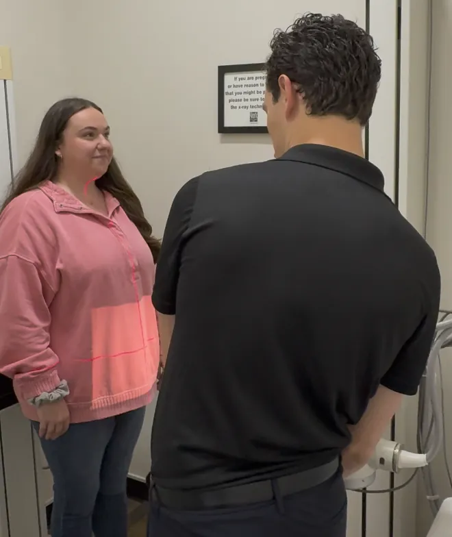 Dr. Kyle Ordille consulting with a patient about X-rays