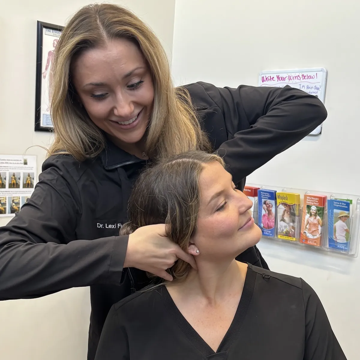 Dr. Lexi Fuchs adjusting a smiling patient's neck