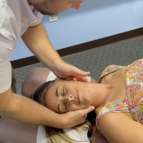 Dr. Vance Kirar adjusting a patient's neck