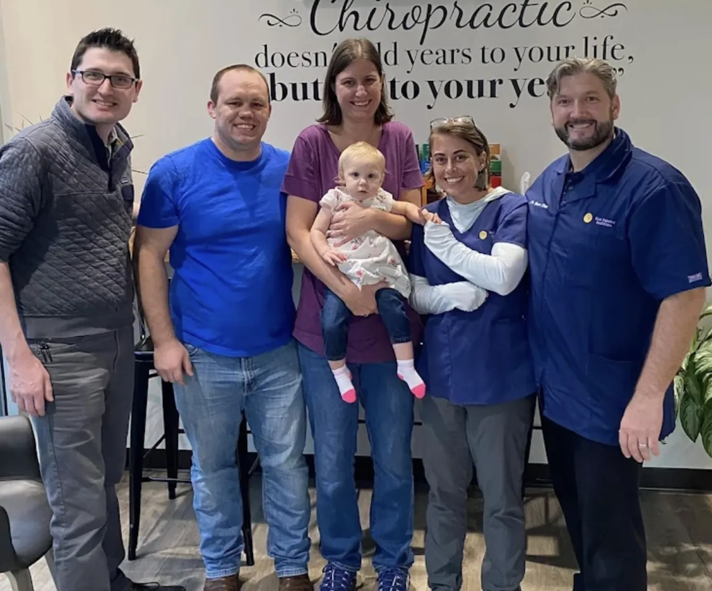 Kirar chiropractors with a family and baby