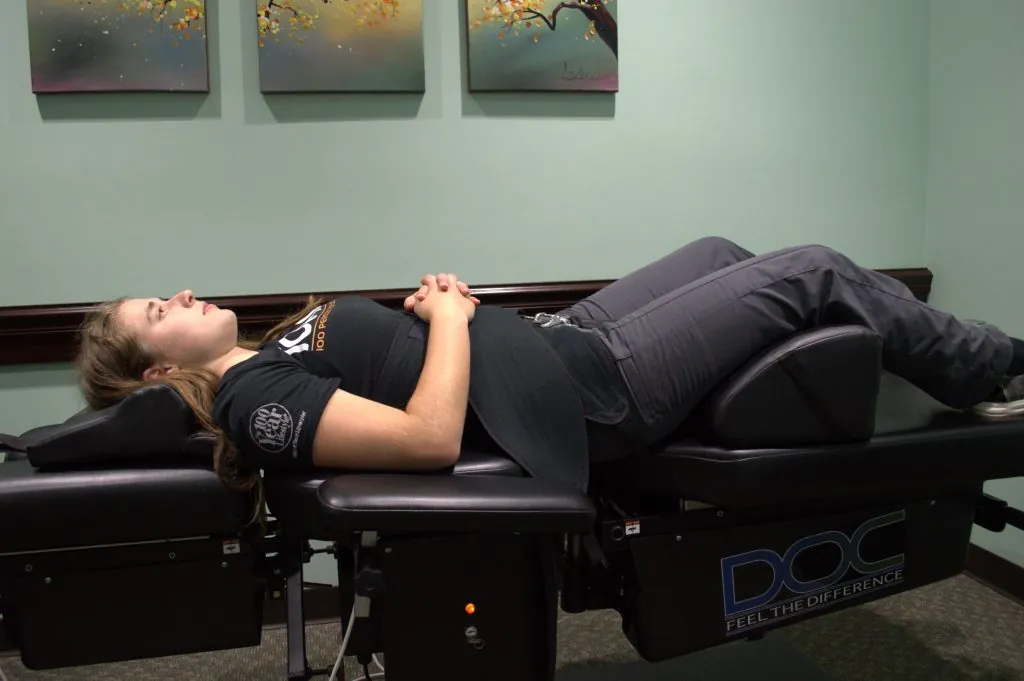 Patient on a spinal decompression table